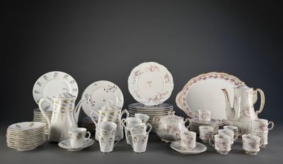many different types of dishes and cups on the table