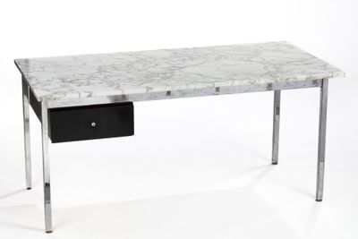 a marble desk with a black drawer underneath it
