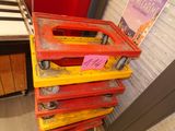 a stack of red and yellow pallets with a sign on it