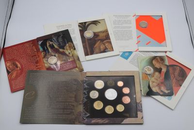 a lot of different coins in a book on a table