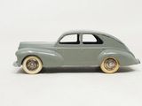 a toy car that is sitting on a white surface