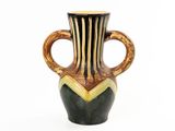 a black and gold vase on a white background