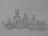 a lot of glass bottles that are sitting on a table