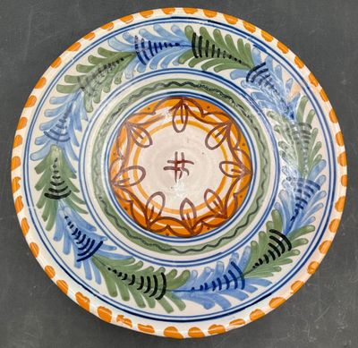 a plate with a design on it sitting on a table