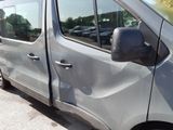 a silver van that is parked in a parking lot