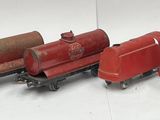 several toy trains are lined up in a row on a white surface