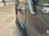 a close up of a car door handle with a sticker on it