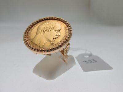 l'image d'un anneau d'or surmonté d'une pièce de monnaie