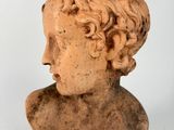 a close up of a statue of a man ' s head on a white background