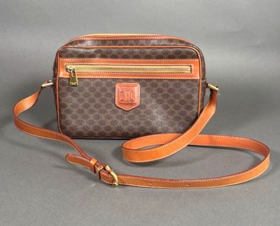 a brown and orange purse with a brown strap