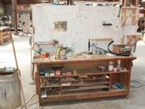 an image of a workbench in a workshop with a lot of tools
