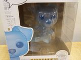 a box with a blue teddy bear in it sitting on a table