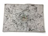 an old map of paris with a butterfly on it