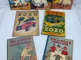 five children ' s books are lined up on a white surface
