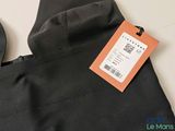 the back of a black backpack with a price tag on it