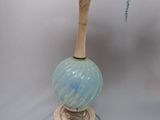 an image of a table lamp with a blue shade on it