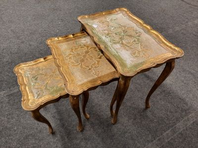 three tables that are sitting side by side on the floor