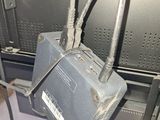 a metal box with wires attached to it in a room