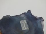a blue vase with a tag on it sitting on a table