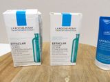 two bottles of la roche - posay effaclar and a tube of eye cream on a table