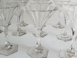 a lot of glasses that are sitting on a table