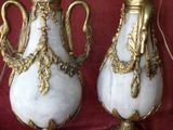 two vases that are sitting on a table