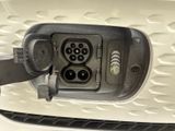 a close up of a car ' s plugged in charging station