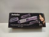 the box of the babylis hair dryer is open on the table