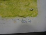 someone is holding a piece of paper with a drawing on it