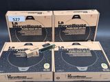 three boxes of electronic equipment sitting on top of a black surface