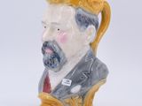 a ceramic figurine of a man with a beard