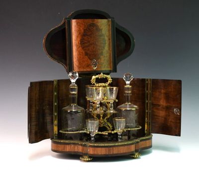 a wooden case with a glass set on top of it