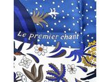 the tie is blue and white with flowers and birds on it