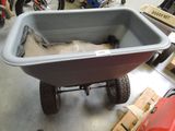 a wheelbarrow with a bag in it in a garage
