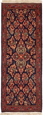 un tapis persan ancien aux motifs rouges, bleus et verts