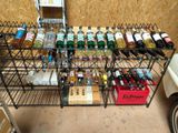 many bottles of alcohol sitting on a rack in a room