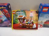 three boxes of legos sitting on a table