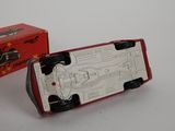 a toy car that is sitting in front of a box