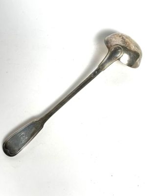a spoon and a spoon rest on a white surface