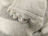 a close up of a sweater with a striped pattern on it
