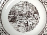 a brown and white plate with a picture of a man and a dog