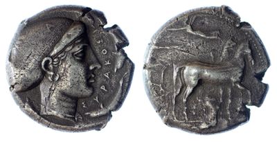 an ancient coin with a woman and a horse on it