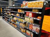 a grocery store aisle with a variety of food items