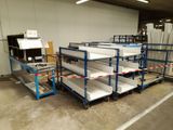 many shelves that are stacked up in a warehouse