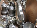 a cardboard box full of silverware on a table