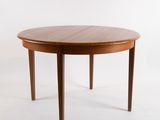 an image of a round dining table with two legs and a wooden top