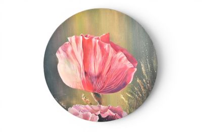 a painting of a pink flower on a round plate