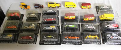 many different types of toy cars in a display case