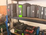 many different types of tools on a shelf in a garage