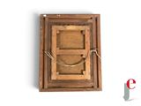 an old wooden picture frame with a rope around it
